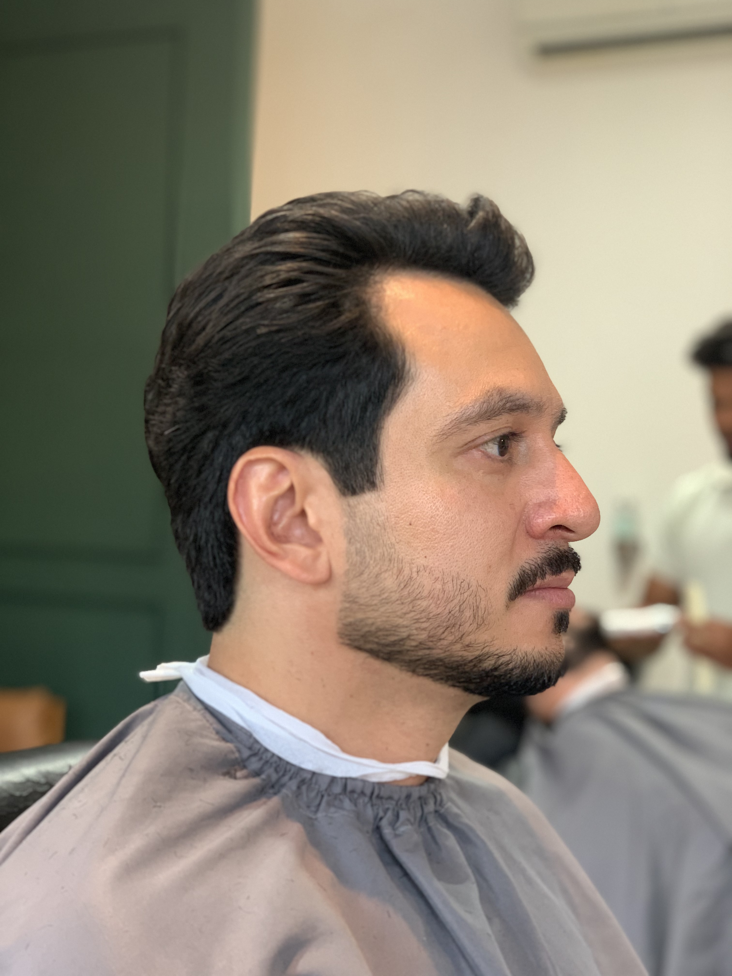 Perfil de cliente com corte e barba finalizados na MUNÊ Barbearia